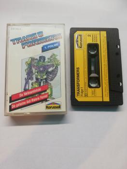 Transformers Folge 1 Die Weltraumbrücke/Die geheime Anti-Materie Formel Schwarz mit gelben Aufkleber 839550-4 Karussell Innencover beschrieben
