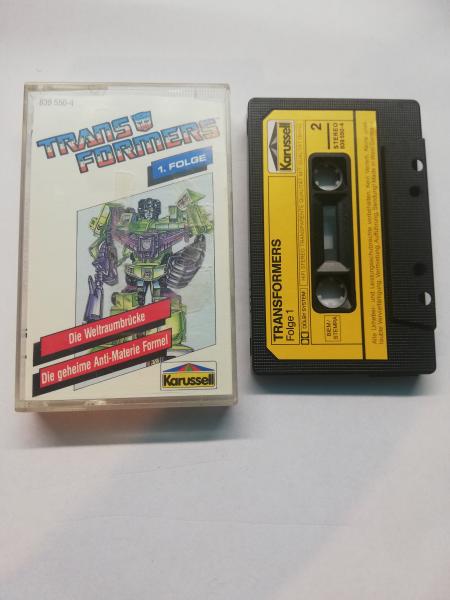 Transformers Folge 1 Die Weltraumbrücke/Die geheime Anti-Materie Formel Schwarz mit gelben Aufkleber 839550-4 Karussell Innencover beschrieben