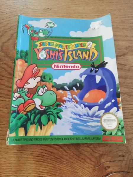 Super Nintendo Super Mario World 2 Yoshi`s Island Spieleberater in gutem Zustand(unten links ganz leichter Abriss)